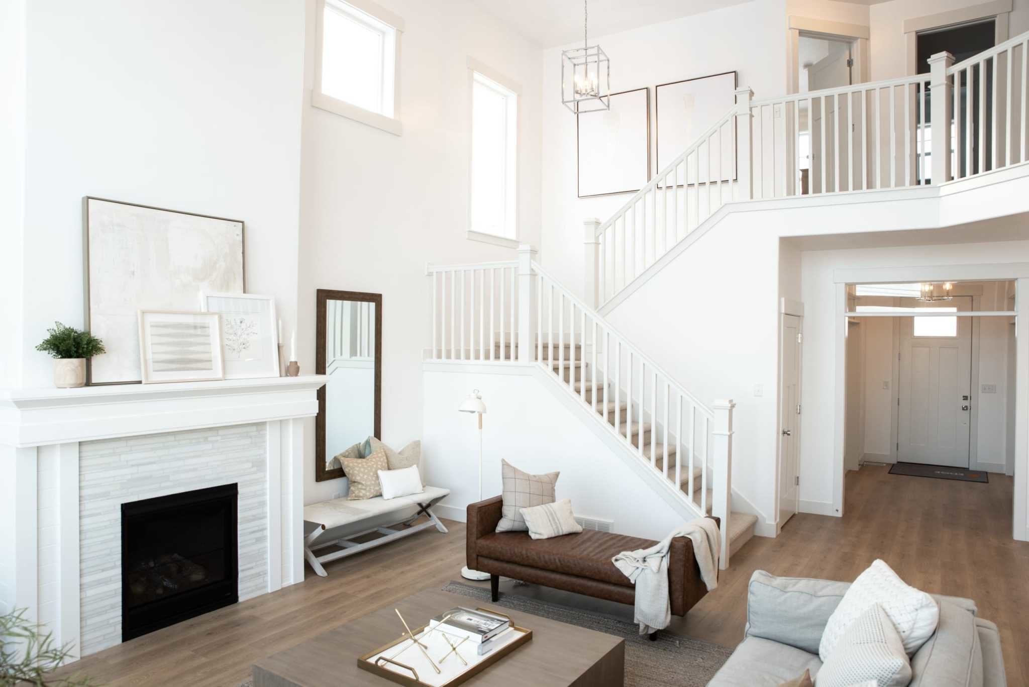 Living room with stairs from The Ridge model home by EDGEhomes