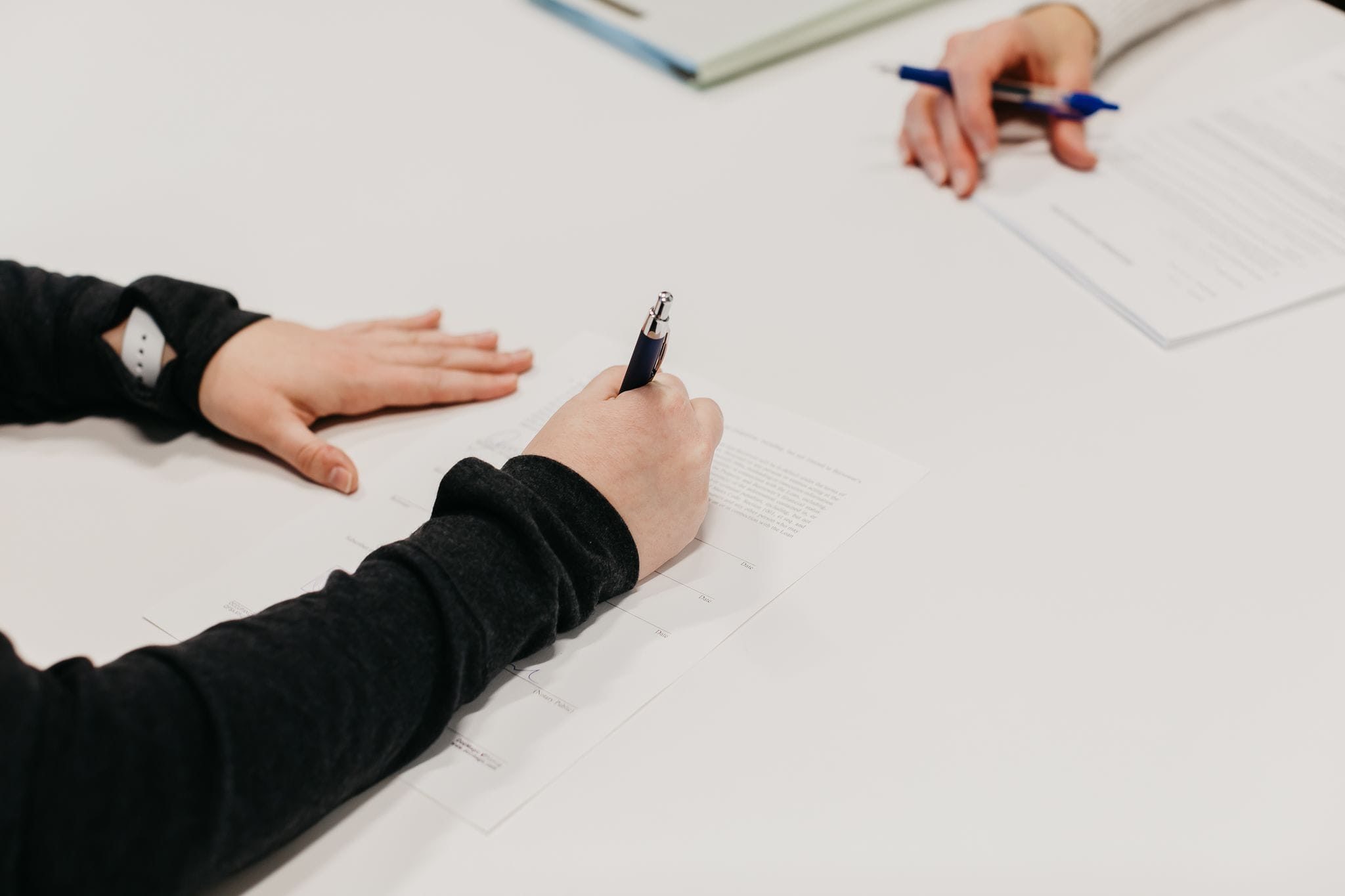 Home buyer signing closing documents