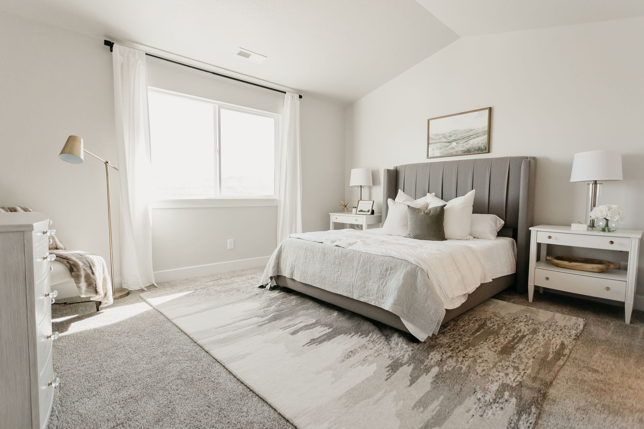 Large bed in a gorgeous bedroom.