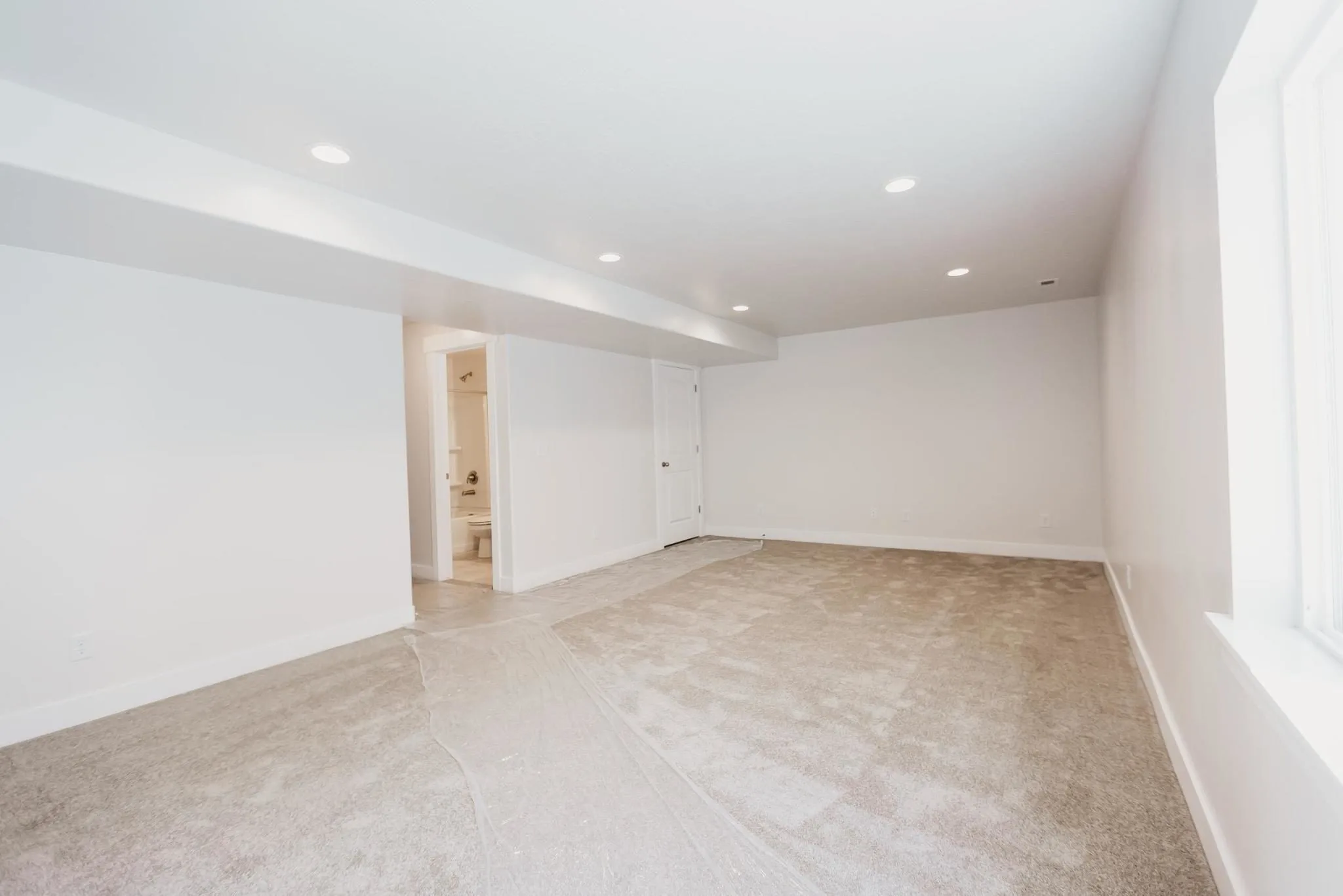 Empty family room in a finished basement