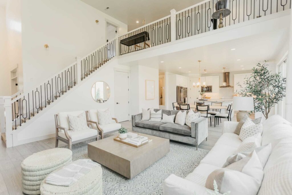 View of furnished Great Room with stairs and balcony overlooking