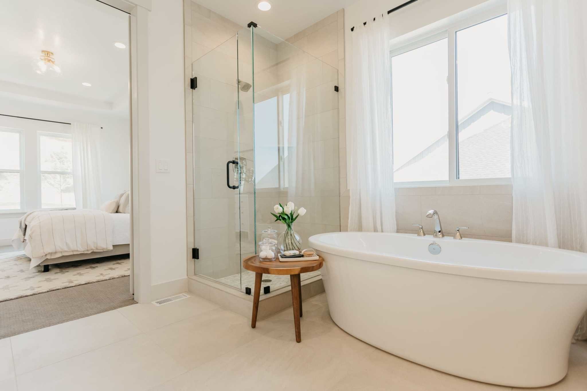 master bathroom with standing shower and deep-set bathtub