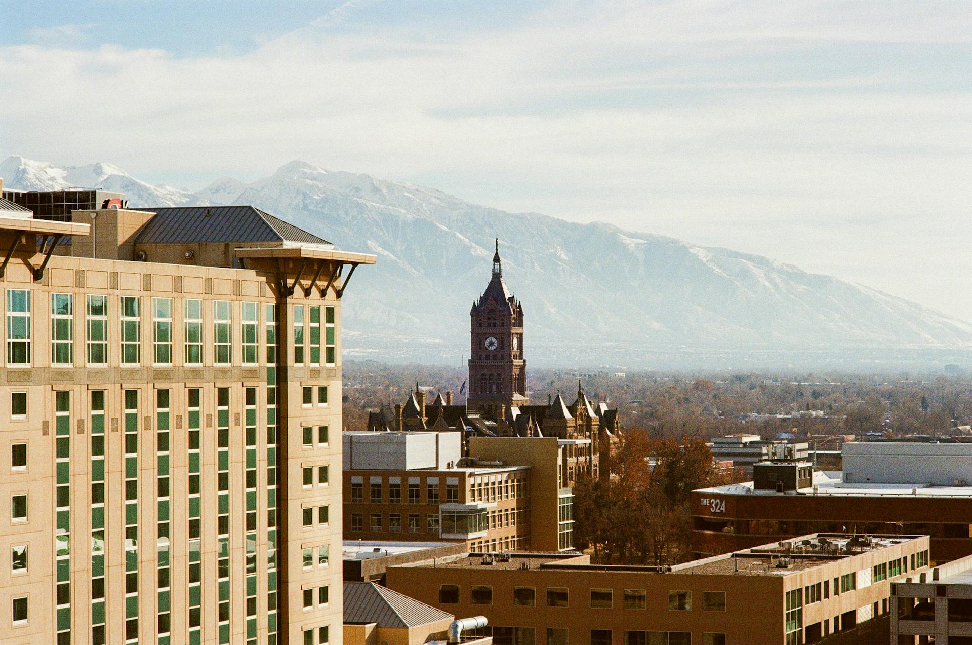 Landscape image of Salt Lake City buildings against mountains